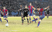 BIG BLOW: FC Basel's Valentin Stocker, right, scores the winning goal during the Champions League last-16 first-leg match against Bayern Munich on February 22. Basel could soon progress to the quarterfinals of the competition for the first time in 20 years Picture: REUTERS
