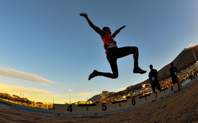 Cheswill Johnson in the mens long jump during the ASA Night Series at Green Point Athletics Stadium on March 22, 2016 in Cape Town, South Africa.