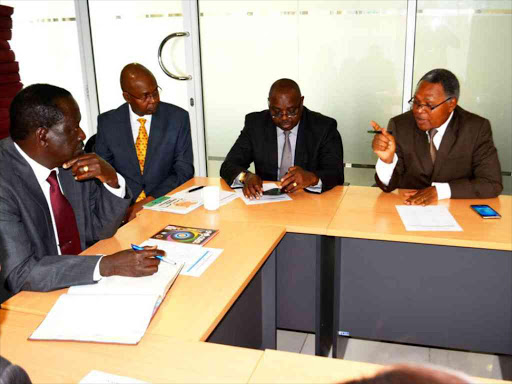 Cord leader Raila Odinga with Taita Taveta leaders at Capitol Hill office. /FILE