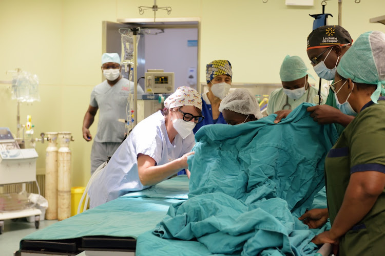 Landry Nion, 9, is being prepared by the medical team of the French association "La Chaine de l'Espoir" for his open-heart surgery, at the General Hospital Tengandogo in Ouagadougou, Burkina Faso on January 13, 2021.