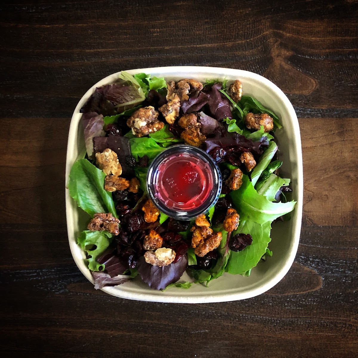 MIXED GREENS & CHICKEN
Seasonal mixed greens, dried sweet cranberries, natural glazed walnuts & grilled chicken. Served with a raspberry-walnut vinaigrette on the side.

*Substitute avocado for chicken as a vegetarian option. Dressing is gluten free.