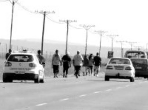 MEGA MARCH: SABC managers in Limpopo joined more than 300 people on a 60km walk from Polokwane to Botlokoa yesterday. Pic. Edward Maahlamela. 13/12/2006. © Sowetan.