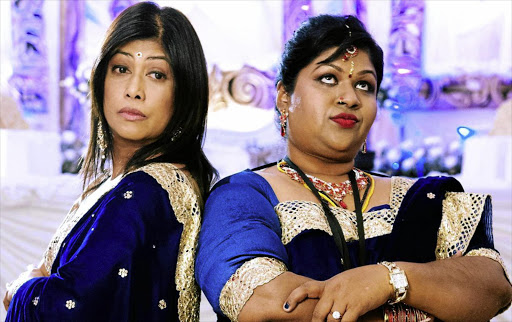 CARRY ON KRISHNA: Jailoshini Naidoo, left, and Maeshni Naicker star as the matriarchal rivals of neighbouring families in Durban who must join forces to keep their children from falling in love.