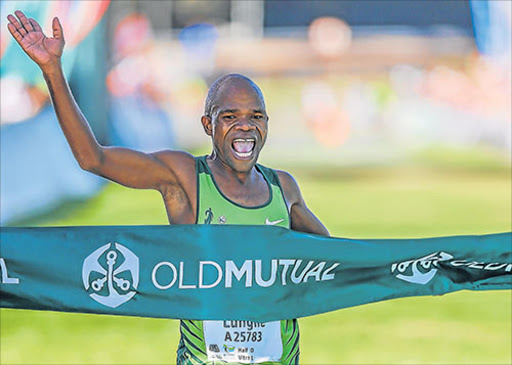 CAPE TOWN, SOUTH AFRICA - APRIL 15: Lungile Gongqa winning the 2017 Old Mutual Two Oceans Marathon 56km on April 15, 2017 in Cape Town, South Africa. (Photo by Roger Sedres/Gallo Images)