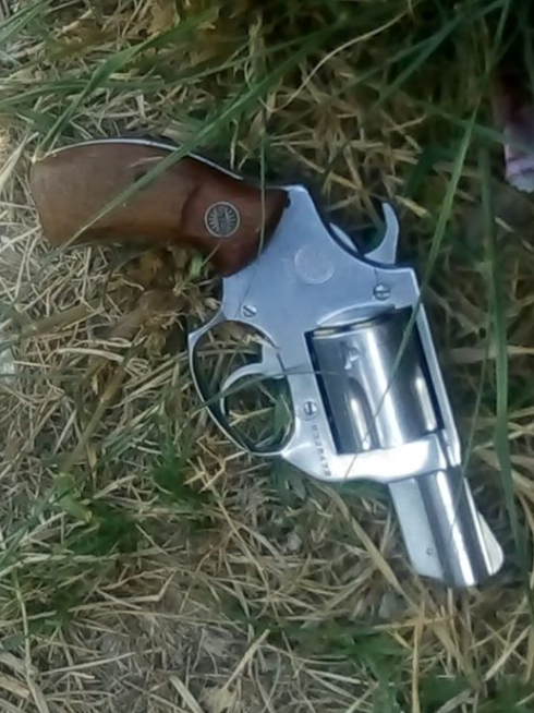 Police found a .38 revolver tucked in the pants of a 20-year-old suspect they arrested in connection with an alleged shootout between rival gangs at the taxi rank near the shopping centre.
