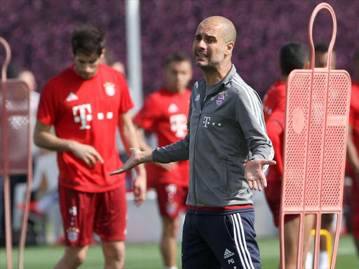 Bayern Munich's coach Pep Guardiola gestures during a training session at his team winter training camp in Doha