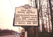 Gold discovered here by 1824. Extensive mining begun 1843, creating a boom town. Copper mined in district until 1907.Plaque via North Carolina Highway Historical Marker Program, and is used with...