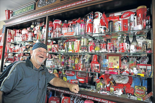 THINGS GO BETTER: Coca-Cola memorabilia collector Peter Bruton has amassed an extraordinary 8500 branded Coke items in his Beacon Bay home, and is hoping to open a Coke museum Picture: ALAN EASON