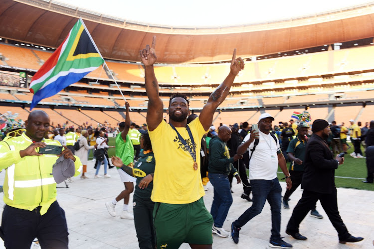 Springbok captain Siya Kolisi greets the crowd during the parade of the Rugby World cup Webb Ellis at FNB Stadium in Johannesburg. Picture: FREDDY MAVUNDA