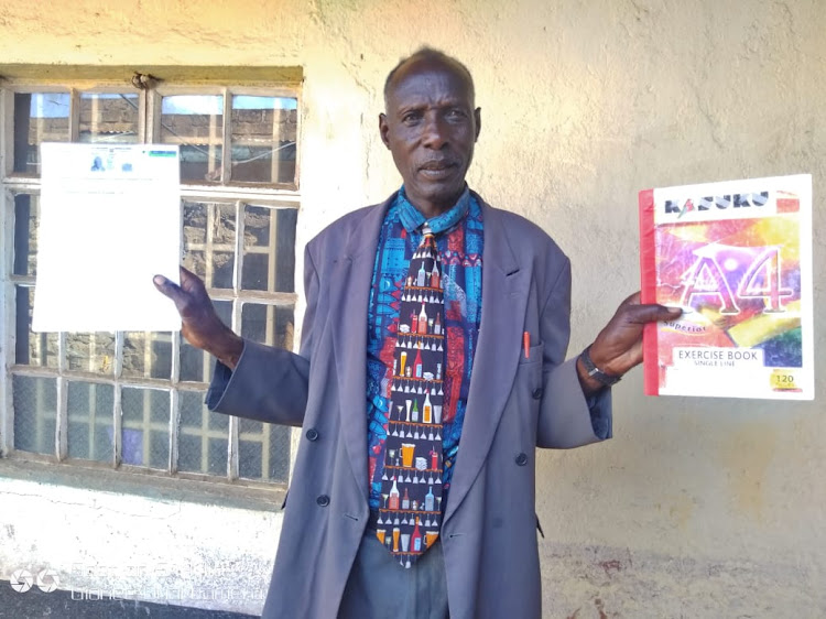 Solomon Tetekori, bandit attack victim at Mogotio, Baringo on Monday displays some documents for previous peace meetings they held with slain peace crusader Mary Kanyaman. image: JOSEPH KANGOGO