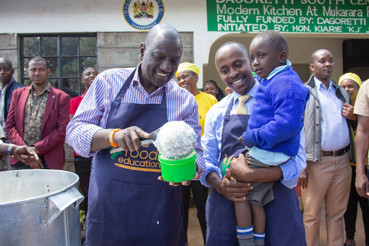 Deputy President William Ruto serving pupils of Mukarara Primary school on Wednesday, May 11, 2022.