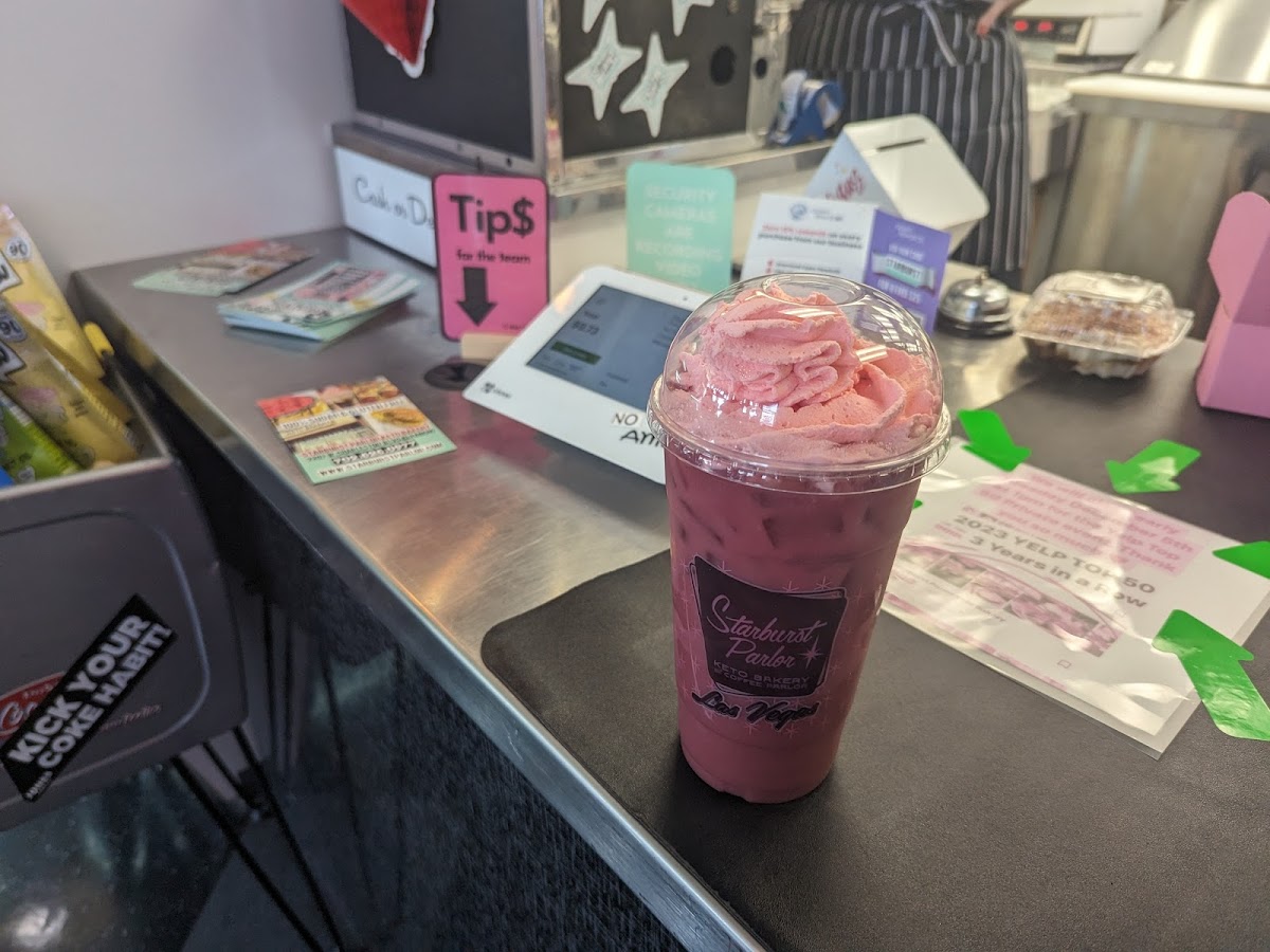 Tasty hibiscus milk tea with whipped cream made on site!