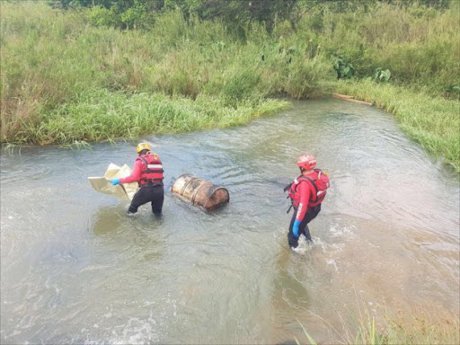 SAPS Search and Rescue teams retrieve a body from the Umgeni River.Picture SUPPLIED