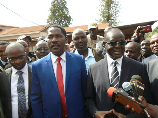 Former Meru governor Peter Munya and his successor Kiraitu Murungi with their lawyers outside Meru high court addressing their supporters on November 27, 2017. /GERALD MUTETHIA