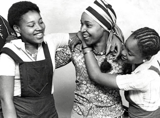 Winnie Mandela returns to her Soweto home in 1975 after six months in jail for contravening her banning order, to be greeted by her daughters, Zenani, 16, left, and Zindzi,14.