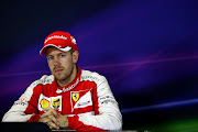 MELBOURNE, AUSTRALIA - MARCH 15:  Sebastian Vettel of Germany and Ferrari attends the post-race press conference after the Australian Formula One Grand Prix at Albert Park on March 15, 2015 in Melbourne, Australia.  (Photo by Mark Thompson/Getty Images)