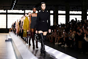 Models present creations from the Gucci Fall/Winter 2024 collection during Fashion Week in Milan.