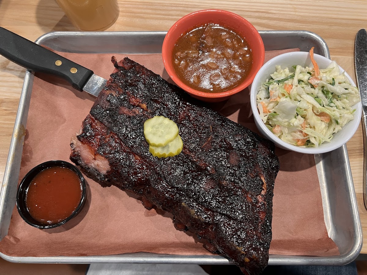 Half rack of ribs with baked beans and coleslaw