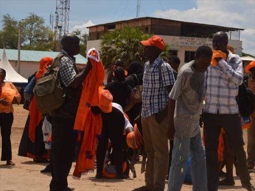 ODM supporters buying ODM attires at tononoka grounds in Mombasa ahead of their rally./JOHN CHESOLI