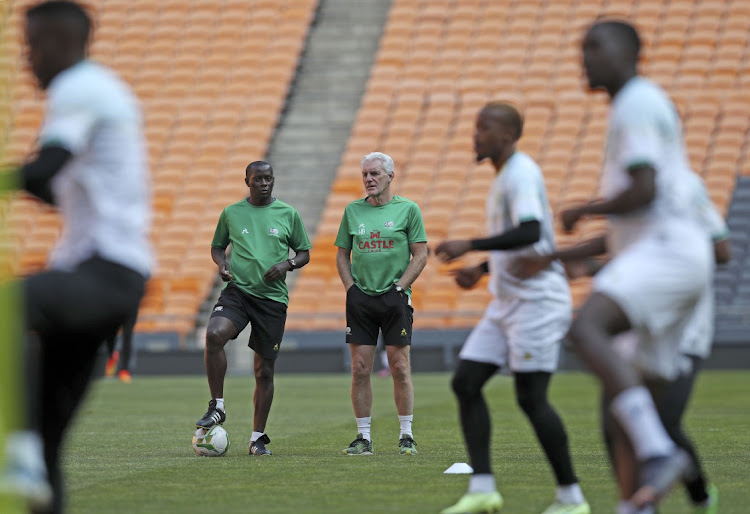 Hugo Broos, coach of South Africa with Helman Mkhelele, assistant coach of South Africa during the 2022 International Friendly at the FNB Stadium, Johannesburg.