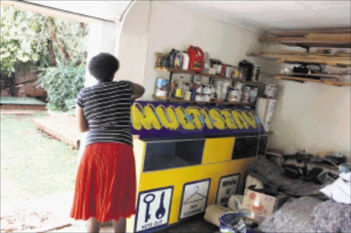 RAW DEAL: Multiserv apparently dumped equipment at the home of franchise owner Anna Radithalo after her lease agreement was not renewed by the company at Key West Mall, from which she operated. Pic.BAFANA MAHLANGU. 26/02/2010. © Sowetan. 20100226 BMA Multiserve frachise dumped their equipment at a clients home after a shopping mall where she operated did not renew the lease agreement. Her husband can not park his care in the garage. PHOTO: BAFANA MAHLANGU