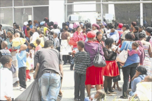 DISGRUNTLED: Some of the people at the re-registration point in Midrand who complained about not getting a chance to apply for social grants . PHOTO: MOHAU MOFOKENG