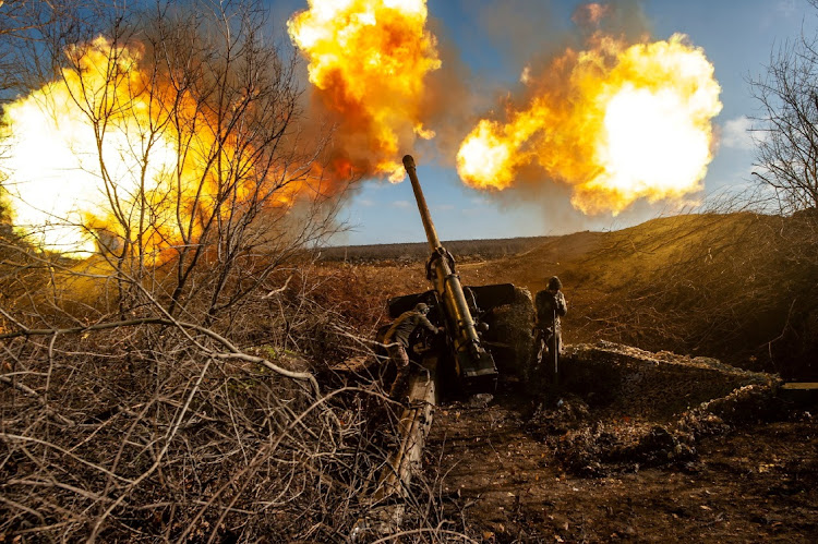 Ukrainian servicemen fire a 130 mm towed field gun M-46 on a front line, as Russia's attack on Ukraine continues, near Soledar, Donetsk region, Ukraine, in this handout image released November 10, 2022.