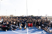 Bam Adebayo is surrounded by excited youngsters in Alex after the NBA unveiled newly renovated basketball courts during their BWB Africa event.