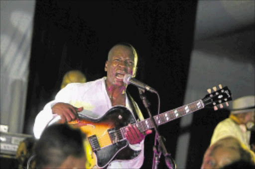TOP STAYS ON: Jazz guitarist and singer Selaelo Selota gets the crowd going.