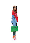 Style blogger Alexandra Lapp with a green Hermes Kelly bag.