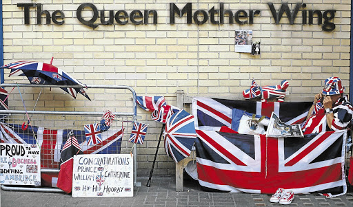 A monarchy fan camping outside St Mary's Hospital, London, where Britain's Catherine, Duchess of Cambridge, is due to give birth 'at any moment now'