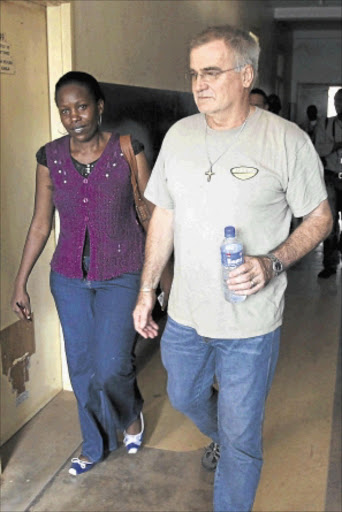 TRYING TIMES: Police spokeswoman Judith Nabakooba with Stewart Fuller, father of Kathryne Fuller, at the central police station in Uganda's capital Kampala. PHOTO: REUTERS