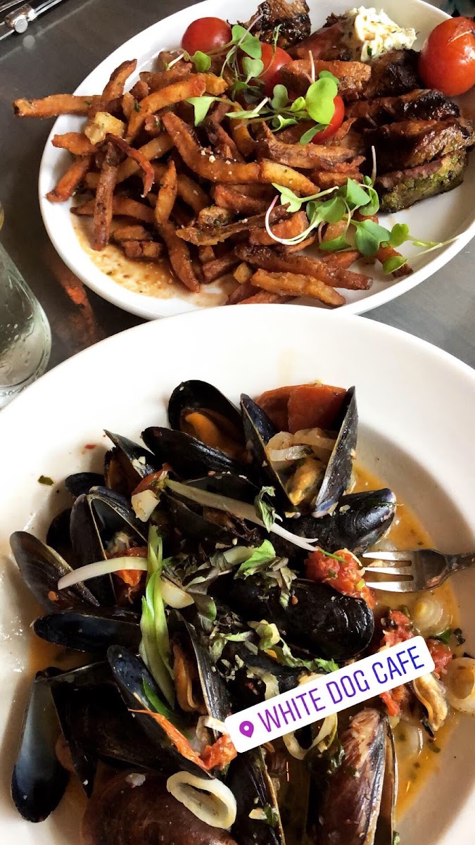 Mussels with wine tomato shallot sauce and steak frites with Parmesan truffle fries!!! So yummy and all gf including designated fryer.