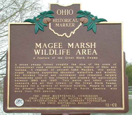 Ohio Historical MarkerMagee Marsh Wildlife AreaA feature of the Great Black SwampA dense swamp forest roughly the size of the state of Connecticut once stretched across this region of Ohio and...