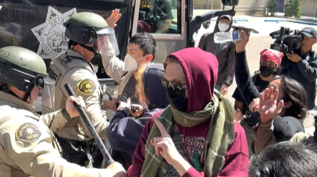 Law enforcement officers clash with students during a protest at UC San Diego, during the ongoing conflict between Israel and the Palestinian Islamist group Hamas, in San Diego, California, US, May 6, 2024, in this screen grab obtained from a social media video.