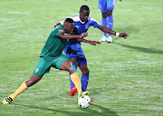 Kagisho Dikgacoi battles Blessing Moyo during the Absa Premiership match between Maritzburg United and Golden Arrows at Harry Gwala Stadium on October 28, 2016 in Durban, South Africa.