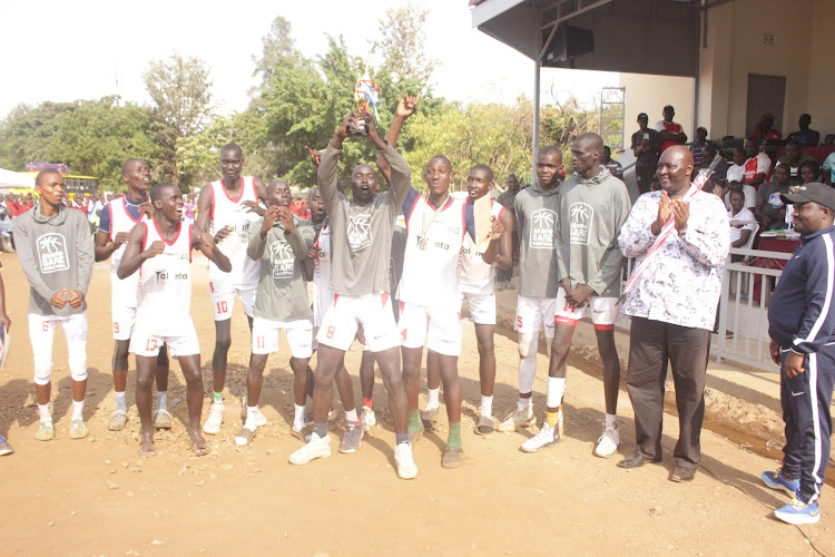 Agoro Sare basketball team celebrate with their principal Isaac Okeyo after lifting the Nyanza region title
