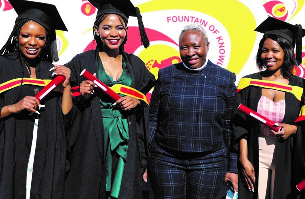 North West Agriculture and Rural Development MEC Desbo Mohono with four of the nine bursary beneficiaries at their graduation.