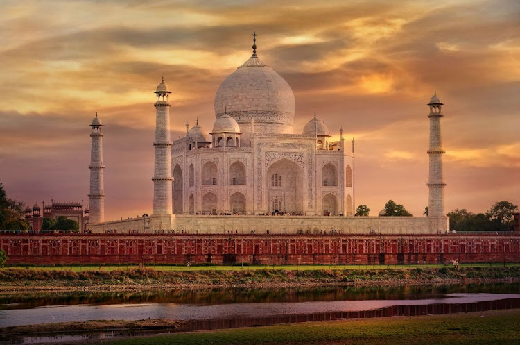 The Taj Mahal has aged and darkened as a result of natural oxidation processes, acid rain, and has been coated in soot from industrial and domestic chimneys.