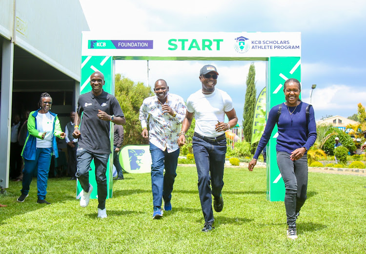 From left: KCB Foundation Director, Mendi Njonjo, cheers as Eliud Kipchoge, The Governor Uasin Gishu County, Jonathan Bii, Sports CS Ababu Namwamba and Faith Kipyegon give a try at each other during the launch of the KCB Scholars Athletes programme held in Eldoret.