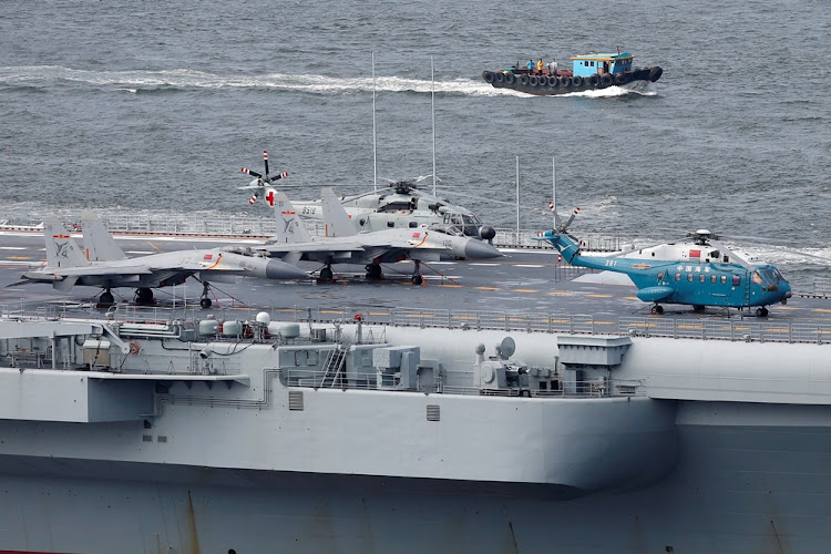 Fighter jets and helicopters are shown parked on board China’s aircraft carrier Liaoning as it sails out of Hong Kong port. File photo: REUTERS