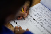 A student at Orangethorpe Elementary School practices writing cursive as California grade school students are being required to learn cursive handwriting this year, in Fullerton, California, U.S.
