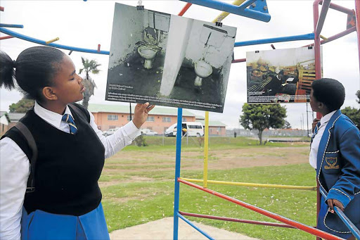 DEPLORABLE STATE: Mary-Kendy Mangiwa and Ziphozothando Mgweje of Forbes Grant Senior Secondary school in Ginsberg at the Nyamezela Photo Exhibition in Zwelitsha yesterday Picture: SIBONGILE NGALWA