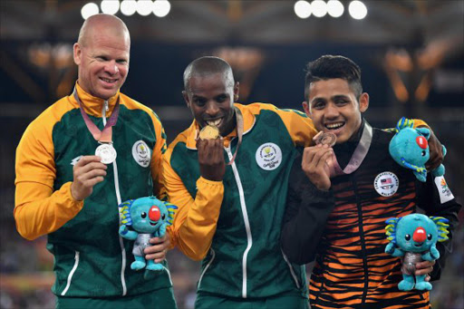 Silver medalist Hilton Langenhoven of South Africa, gold medalist Ndodomzi Ntutu of South Africa and bronze medalist Muhamad Afiq Mohamad Ali Hanafiah of Malaysia pose during the medal ceremony for the Mens T12 100 metresduring athletics on day eight of the Gold Coast 2018 Commonwealth Games at Carrara Stadium on April 12, 2018. Picture: Getty Images