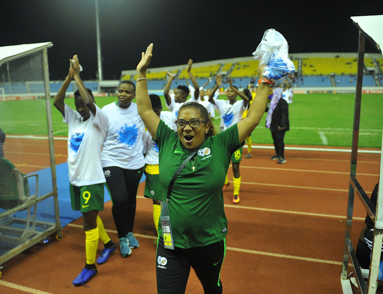 Banyana Banyana head coach Desiree Ellis leads a celebration with her players after beating Mali 2-0 to advance to the final of the Caf Women's Africa Cup of Nations against Nigeria.