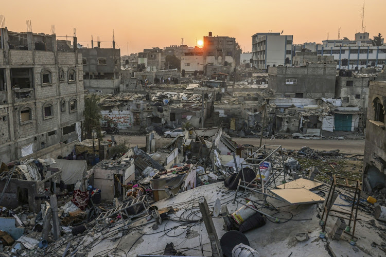 The sun rises above the Rafah refugee camp in the southern Gaza Strip. Picture: AFP via GETTY IMAGES