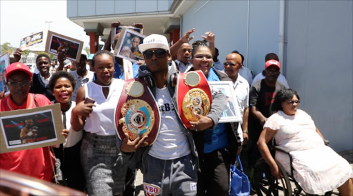 Hero's welcome: Zolani Tete arrives at the East London airport. Picture: BHONGO JACOB