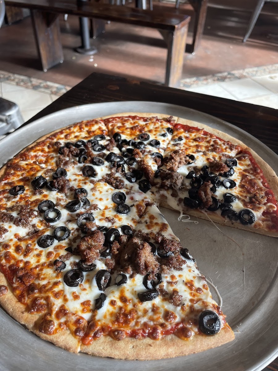 GF crust with ground beef and black olives