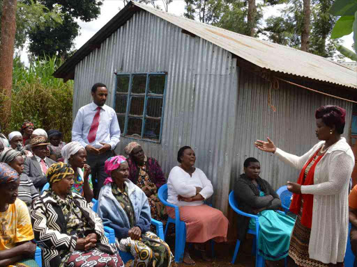 Ngewa Ward MCA Standing) With Grace Wanjiku of GWM Cancer Foundation in a cancer sensitization meeting with women and men in Mitahato village Githunguri subcounty. They agitated cancer be made a national disaster.