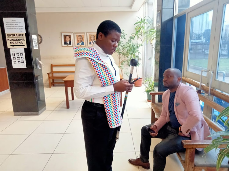 Patriotic Alliance member and former Fees Must Fall activist Bonginkosi Khanyile, who was arrested for incitement of violence during last year's July riots, arrived at his trial with an embroidered stick that caused concern with security personnel at the Durban magistrate's court.